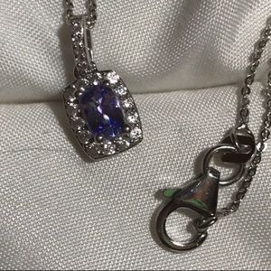 Genuine Tanzanite with Zircons in Platform over Sterling Silver.